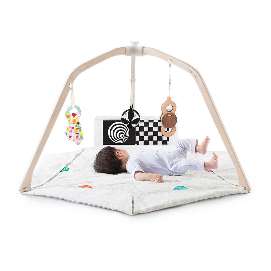 Baby laying in The Play Gym by Lovevery